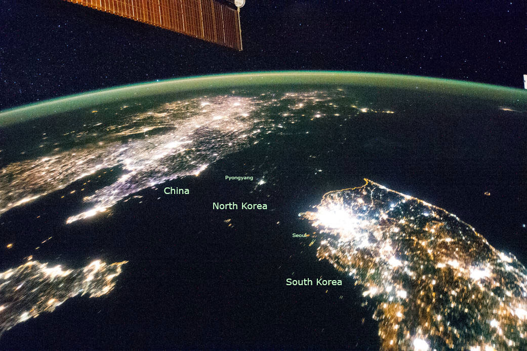 A 2014 nighttime satellite photo of the Korean Peninsula contrasting the conspicuous lights of civilization in China and South Korea with the near total darkness of North Korea.